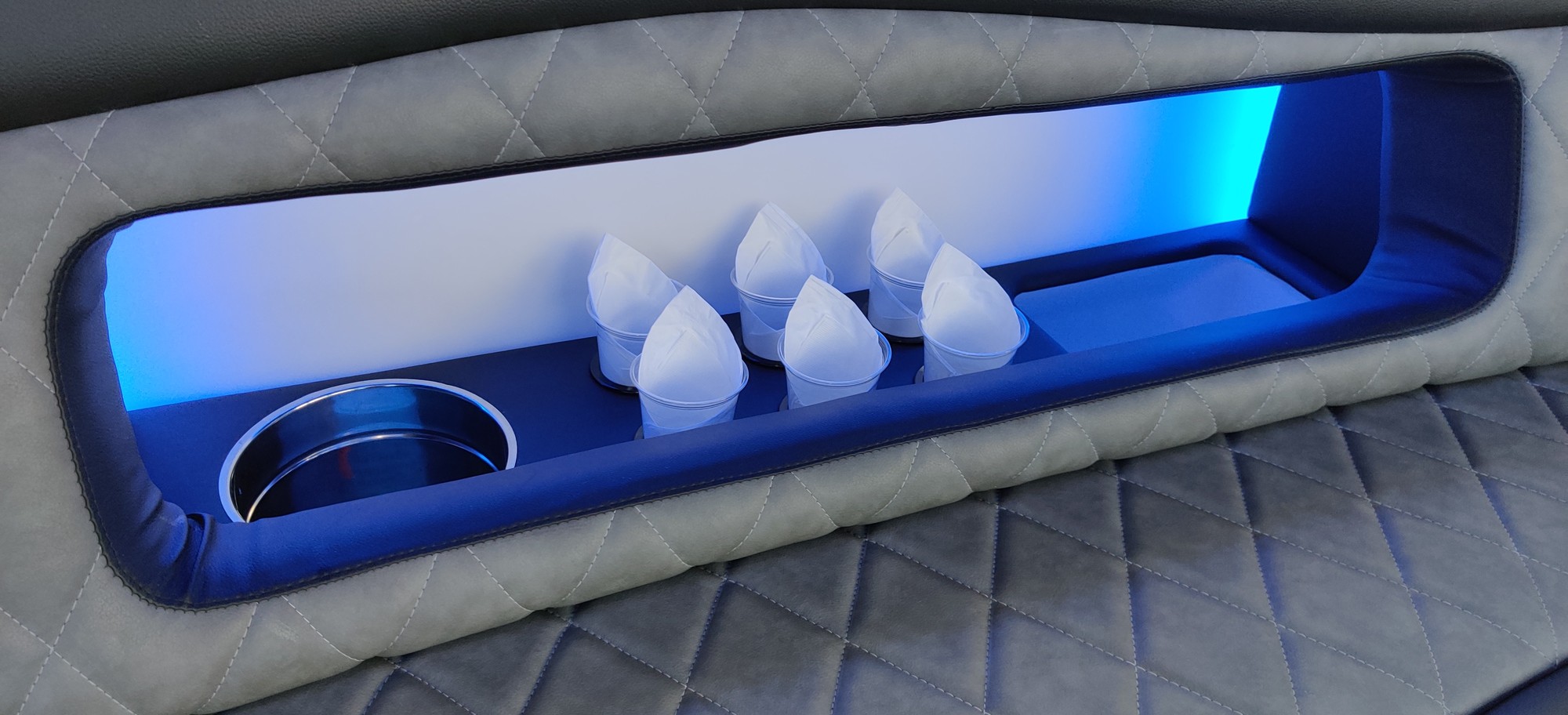 Luxury limo bus LED-lit interior with bar